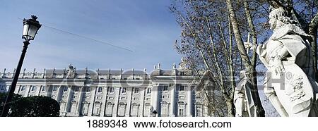 Stock Photo - Statues In Plaza De Oriente And Royal Palace. Fotosearch