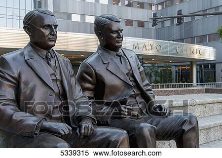 Stock Photography - Statues of men sitting outside the Mayo Clinic; Rochester, Minnesota, United States of America. Fotosearch