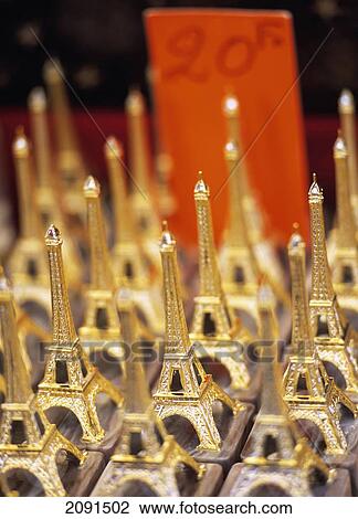 Stock Image - Statues Of The Eiffel Tower, Paris, France.. Fotosearch
