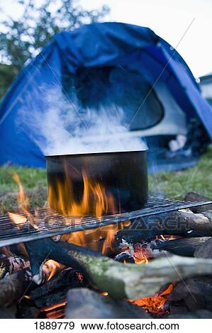 Steaming Pot On Campfire With Tent In Background View Large Photo Image Stock Photo - Steaming Pot On Campfire With Tent In Background. Fotosearch