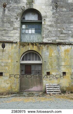 Stock Photography - Steampunk HQ stone wall and door; Oamaru, South Island, New Zealand. Fotosearch
