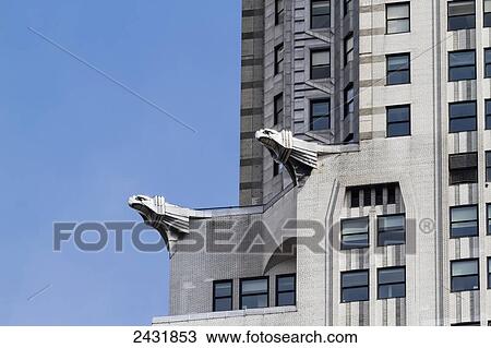 Stock Image - Steel gargoyles, depicting American eagles, on the Chrysler Building, New York City, New York, United States. Fotosearch