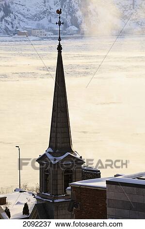 Steeple Of Notre-Dame-Des-Victoires And Fog Over Saint Lawrence River; Quebec City Quebec Canada View Large Photo Image Stock Photo - Steeple Of Notre-Dame-Des-Victoires And Fog Over Saint Lawrence River; Quebec City Quebec Canada. Fotosearch