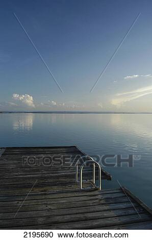 Stock Image - Steps At End Of Pier Leading Into Calm Water, Montego Bay, Jamaica.. Fotosearch