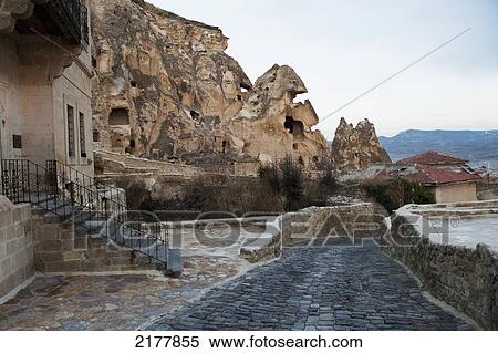 Stock Photography - Steps Coming Out Of The Side Of A Building With A Stone Street Lined By Short Stone Walls; Nevsehir Turkey. Fotosearch