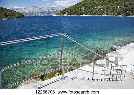 Steps to a platform for swimming in the Adriatic Sea; Pucisca, Brac, Croatia View Large Photo Image Stock Photography - Steps to a platform for swimming in the Adriatic Sea; Pucisca, Brac, Croatia. Fotosearch