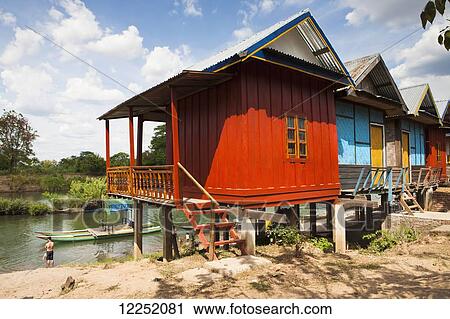 Stilt house on the island of Don Det on the Mekong River along the Cambodia/Laos border; Si Phan Don, Laos View Large Photo Image Stock Image - Stilt house on the island of Don Det on the Mekong River along the Cambodia/Laos border; Si Phan Don, Laos. Fotosearch
