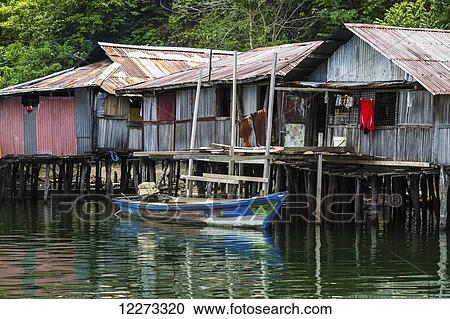Stock Image - Stilt houses in Kampung Ayapo, Lake Sentani, Papua, Indonesia. Fotosearch