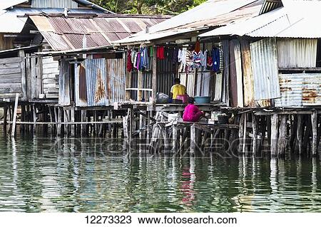 Stilt houses in Kampung Ayapo, Lake Sentani, Papua, Indonesia View Large Photo Image Stock Image - Stilt houses in Kampung Ayapo, Lake Sentani, Papua, Indonesia. Fotosearch