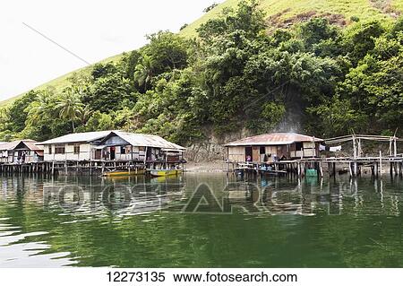 Stilt houses in Kampung Ayapo, Lake Sentani, Papua, Indonesia View Large Photo Image Stock Photography - Stilt houses in Kampung Ayapo, Lake Sentani, Papua, Indonesia. Fotosearch