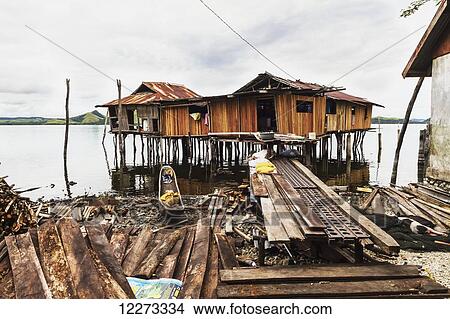 Stilt houses on Pulao Asei, island in Lake Sentani, Papua, Indonesia View Large Photo Image Picture - Stilt houses on Pulao Asei, island in Lake Sentani, Papua, Indonesia. Fotosearch