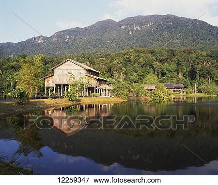 Stock Photo - Stilted longhouse at the Sarawak Cultural Centre; Sarawak. Fotosearch