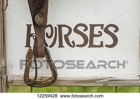 Stirrup in front of horses sign, near Hurlock; Maryland, United States of America View Large Photo Image Stock Photo - Stirrup in front of horses sign, near Hurlock; Maryland, United States of America. Fotosearch