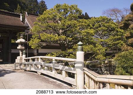 Stock Image - Stone Bridge At The Entrance Of A Japanese Temple; Koyasan Wakayama Japan. Fotosearch