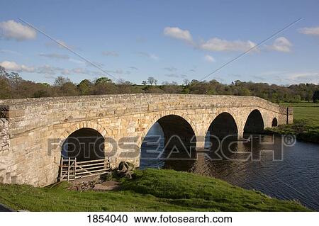 Stock Image - Stone Bridge, Northumberland, England. Fotosearch