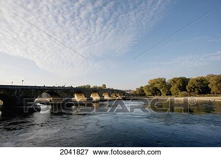 Stock Photo - Stone Bridge Over The Danube River, Regensburg, Bavaria, Germany. Fotosearch