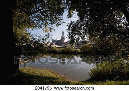 Stock Photography - Stone Bridge Over The Danube River With The St. Peter's Cathedral In The Background, Regensburg, Bavaria, Germany. Fotosearch