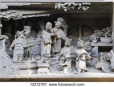 Stock Photo - Stone carvings of daily life in the Zaoyao Gaoxiang gate of the Master of the Nets Garden, Suzhou, Jiangsu, China. Fotosearch