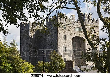Stone castle framed within trees with clouds and blue sky; Bunratty, County Clare, Ireland View Large Photo Image Stock Image - Stone castle framed within trees with clouds and blue sky; Bunratty, County Clare, Ireland. Fotosearch