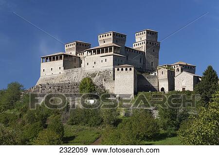 Stone castle on hill with blue sky; Torrechiara, Emilia-Romagna, Italy View Large Photo Image Stock Photo - Stone castle on hill with blue sky; Torrechiara, Emilia-Romagna, Italy. Fotosearch
