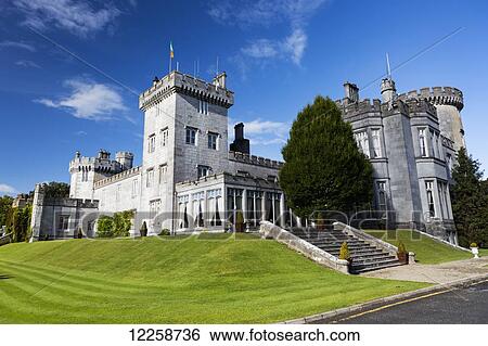 Stone castle on manicured grassy hillside with blue sky and clouds; County Clare, Ireland View Large Photo Image Stock Photograph - Stone castle on manicured grassy hillside with blue sky and clouds; County Clare, Ireland. Fotosearch