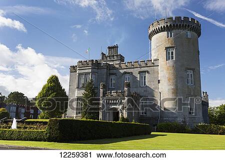 Stone castle with turret, manicured grass, gardens, fountain, blue sky and clouds; County Clare, Ireland View Large Photo Image Stock Image - Stone castle with turret, manicured grass, gardens, fountain, blue sky and clouds; County Clare, Ireland. Fotosearch