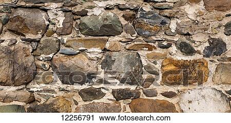 Stock Image - Stone foundation on barn; Foster, Quebec, Canada. Fotosearch