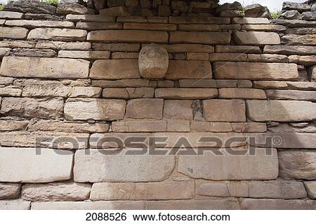 Stock Photograph - Stone Head Decorating A Wall Of The Main Temple, Chavin De Huantar, Ancash, Peru. Fotosearch