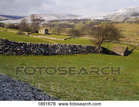 Stock Photo - Stone Hedge On Field. Fotosearch