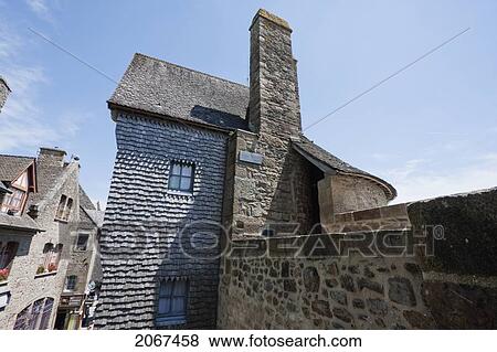 Stock Photo - Stone House In The Fortified Village Built On The Bastion Of Mont-Saint-Michel, France. Fotosearch