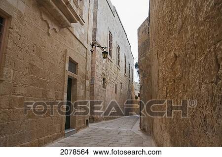 Stone Houses On A Narrow Street, Mdina, Malta View Large Photo Image Picture - Stone Houses On A Narrow Street, Mdina, Malta. Fotosearch