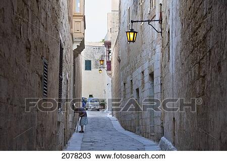 Stock Image - Stone Houses On A Narrow Street, Mdina, Malta. Fotosearch