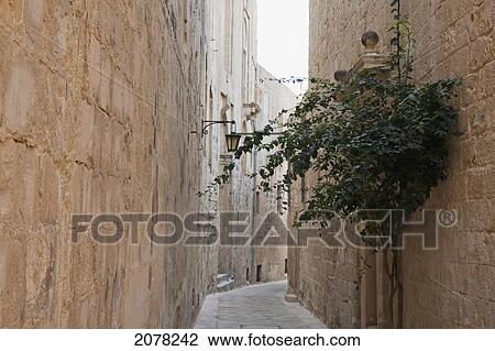 Stone Houses On A Narrow Street, Mdina, Malta View Large Photo Image Stock Image - Stone Houses On A Narrow Street, Mdina, Malta. Fotosearch