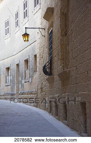Stone Houses On A Narrow Street, Mdina, Malta View Large Photo Image Stock Image - Stone Houses On A Narrow Street, Mdina, Malta. Fotosearch