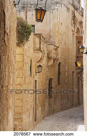 Stock Photo - Stone Houses On A Narrow Street, Mdina, Malta. Fotosearch