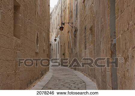 Stone Houses On A Narrow Street, Mdina, Malta View Large Photo Image Stock Photograph - Stone Houses On A Narrow Street, Mdina, Malta. Fotosearch