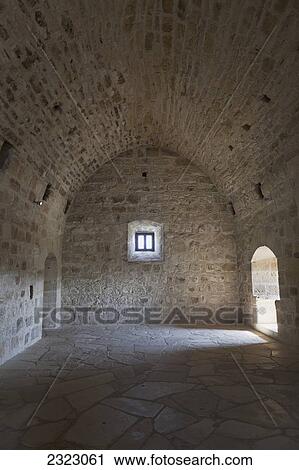 Stock Image - Stone interior with arched ceiling; Kolossi, Cyprus. Fotosearch