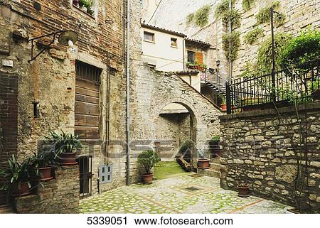 Stone residential buildings with decorative plants; Todi, Umbria, Italy View Large Photo Image Stock Image - Stone residential buildings with decorative plants; Todi, Umbria, Italy. Fotosearch