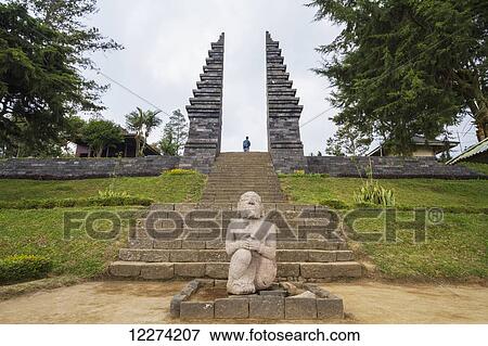 Stock Photo - Stone statue and ceremonial gate of Candi Cetho, a Javanese-Hindu temple located on the western slope of Mount Lawu, Central Java, Indonesia. Fotosearch