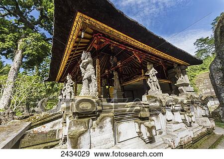 Stock Photo - Stone statue of a deity at the Pura Gunung Kawi temple complex, Tampaksiring, Bali, Indonesia. Fotosearch
