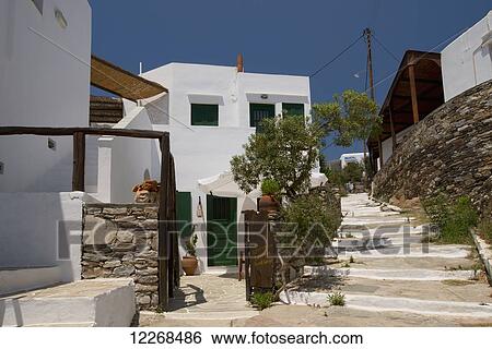 Stock Photograph - Stone steps next to a guest house in Faros on the Southeast coast of Sifnos; Faros, Sifnos, Cyclades, Greek Islands, Greece. Fotosearch