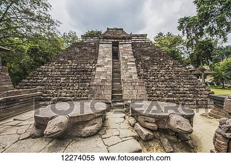 Stock Photography - Stone turtles in front of the Central pyramid of the 15th-century Javanese-Hindu temple, Candi Sukuh, Central Java, Indonesia. Fotosearch