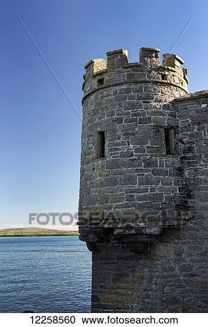 Stone wall with turret at water's edge and blue sky; Carrigaholt, County Clare, Ireland View Large Photo Image Stock Image - Stone wall with turret at water's edge and blue sky; Carrigaholt, County Clare, Ireland. Fotosearch
