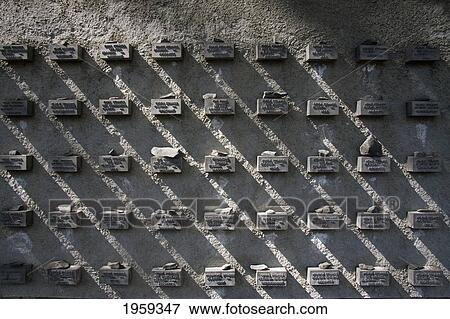 Stock Photo - Stones Placed On The Holocaust Memorial Wall Surrounding The Old Jewish Cemetery At Frankfurt Am Main In Germany. Fotosearch