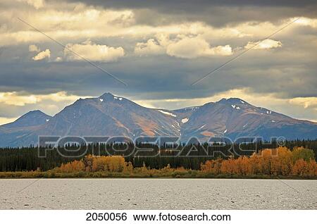 Stock Photograph - Storm Clouds Above Dawson Peaks In Autumn, Teslin, Yukon. Fotosearch