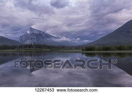 Storm clouds over Mount Rundle and the Vermillion Lakes, Banff National Park; Alberta, Canada View Large Photo Image Stock Image - Storm clouds over Mount Rundle and the Vermillion Lakes, Banff National Park; Alberta, Canada. Fotosearch