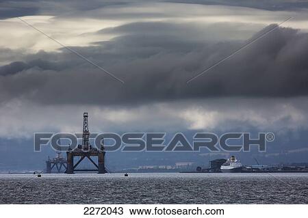 Stock Image - Storm Clouds Over The Ocean Along The Coast; Inverness Scotland. Fotosearch