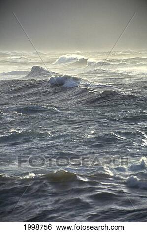 Stock Photograph - Storm Surf At Sunset B1495. Fotosearch
