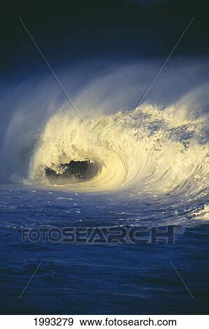 Stock Photo - Stormy Ocean Wave Curling Over With Whitewash And A Barrel Forming. Fotosearch