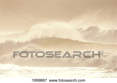 Stock Photo - Stormy Whitewash Wave With Misty Orange Brown Sky, Golden Reflections C1755. Fotosearch